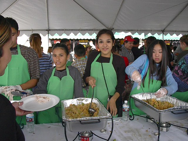 Roxy & Aida help serve food